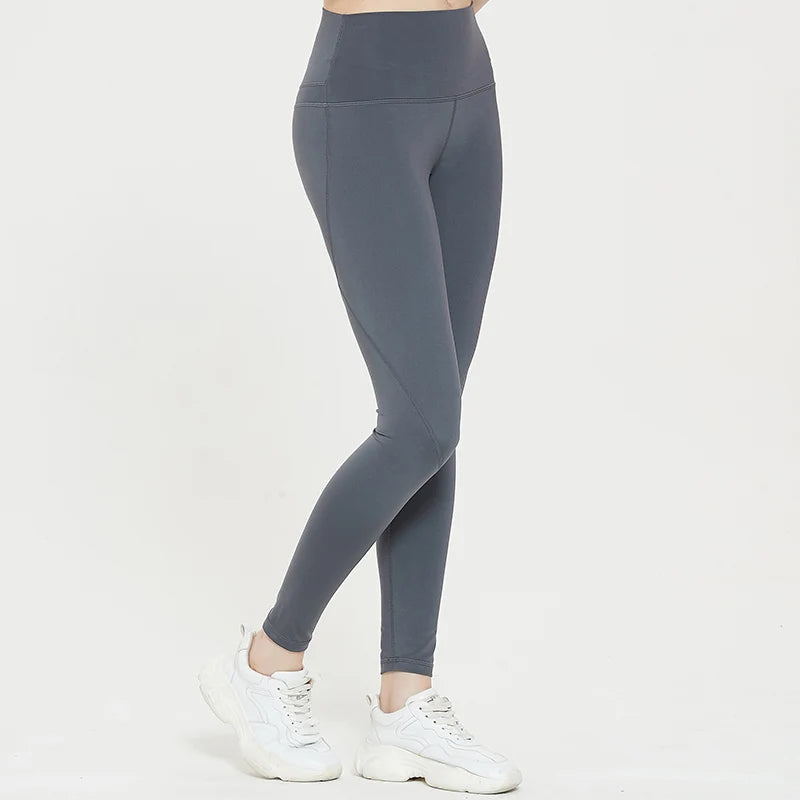 Gray spandex sports shorts shown on a person, highlighting flexibility and snug fit.