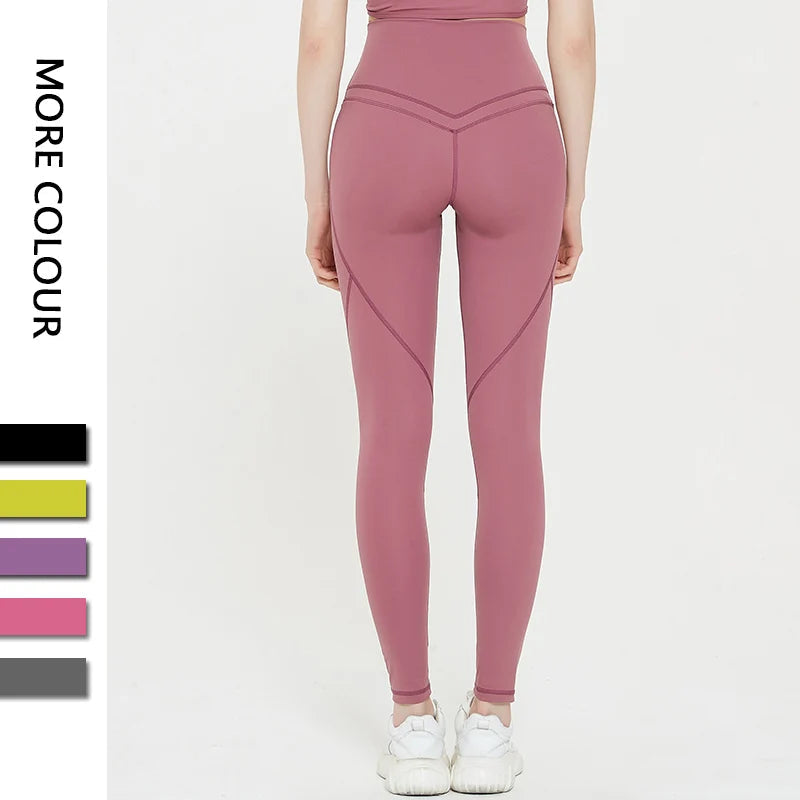 Back view of person wearing Spandex Sports Shorts in pink, showcasing secure fit and elastic waistband, with color options displayed.