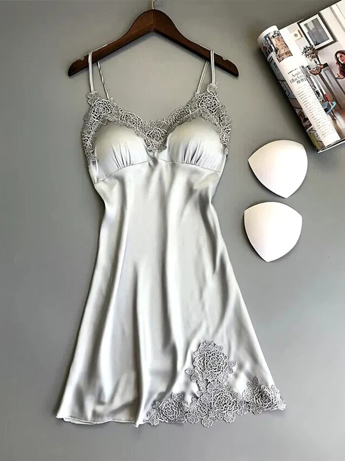 Summer backless ice silk nightgown with lace detail, hanging on a wooden hanger, providing a luxurious and breathable sleepwear option.