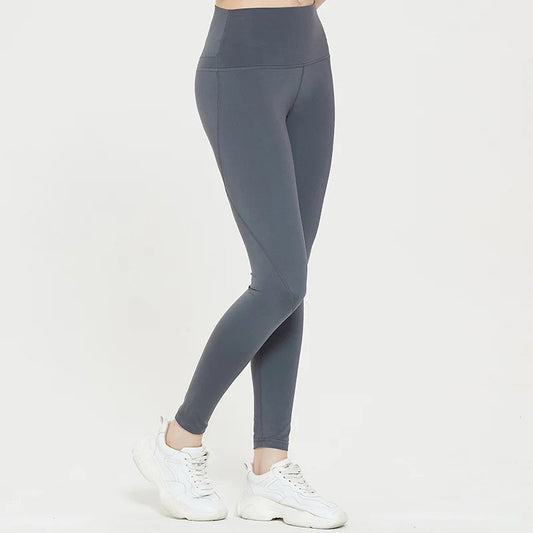 Gray spandex sports shorts shown on a person, highlighting flexibility and snug fit.