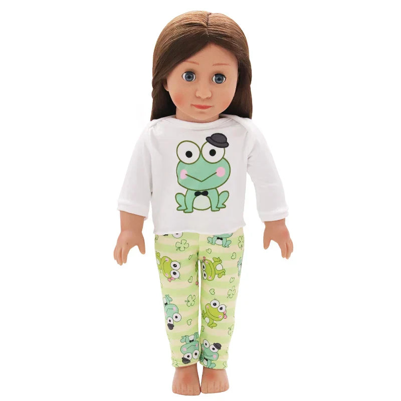 Soft Doll Pajama Set with frog design on shirt and pants, displayed on a doll.