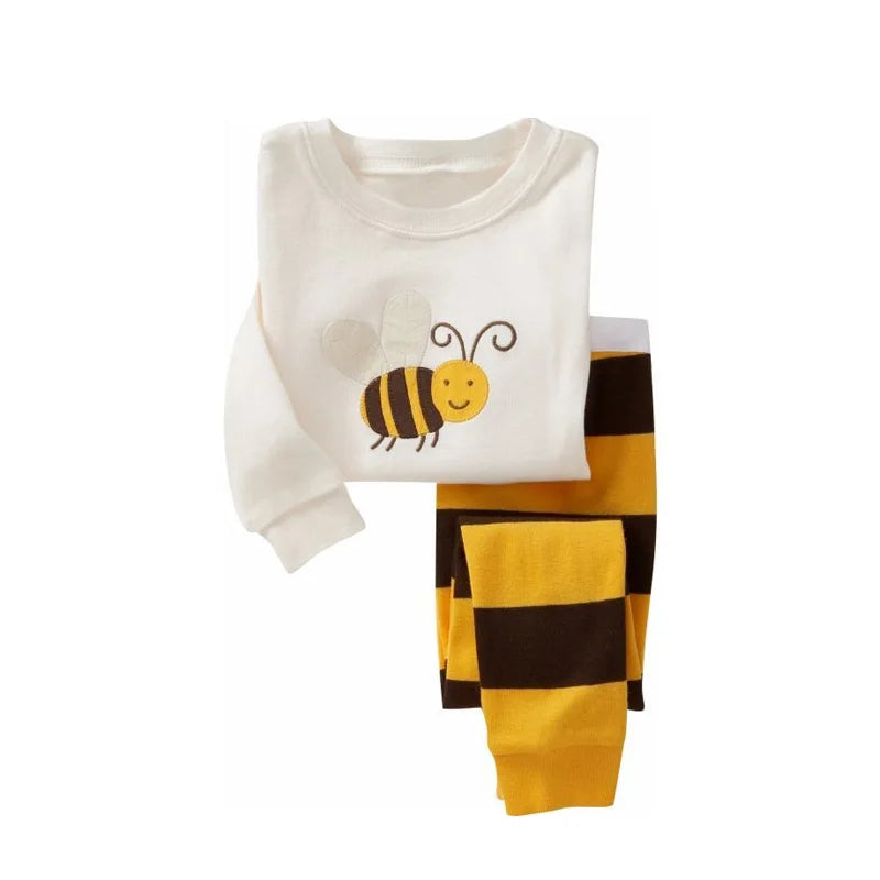 Kids Animal Pajama Set with a white knit cotton top featuring a smiling bee and yellow-and-brown striped pants.