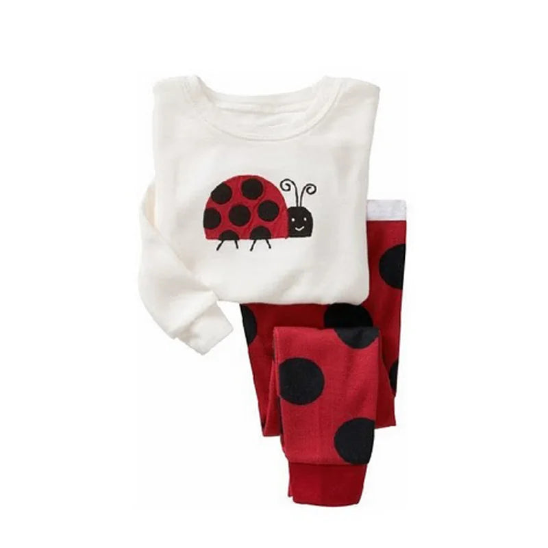 Kids Animal Pajama Set with a white cotton knit top and red bottoms, featuring a ladybug and bold black spots.