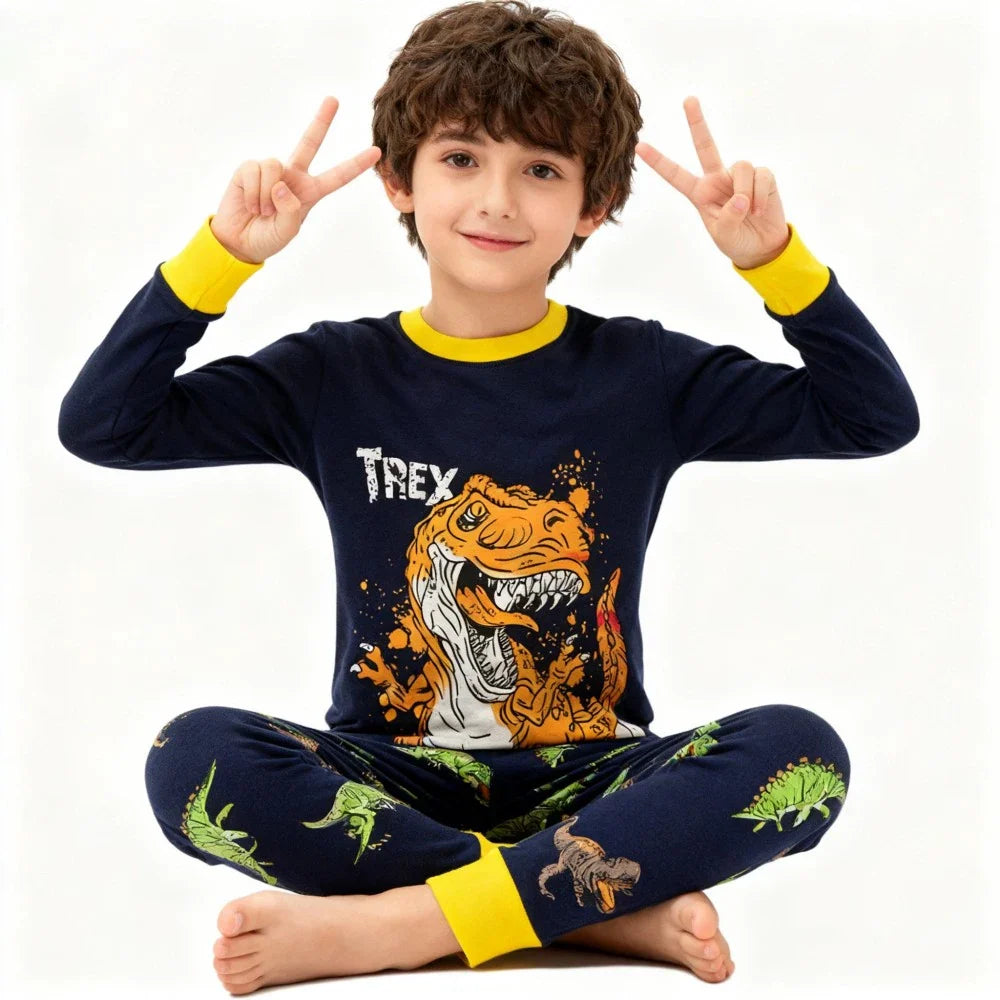 Kids Animal Pajama Set in navy knit cotton, with yellow cuffs and collar and a bold T-Rex print on the top and pants.
