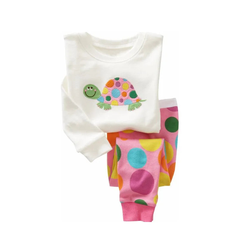 Kids Animal Pajama Set in soft knit cotton, with a white turtle-appliqué top and pink multicolour polka-dot pants.
