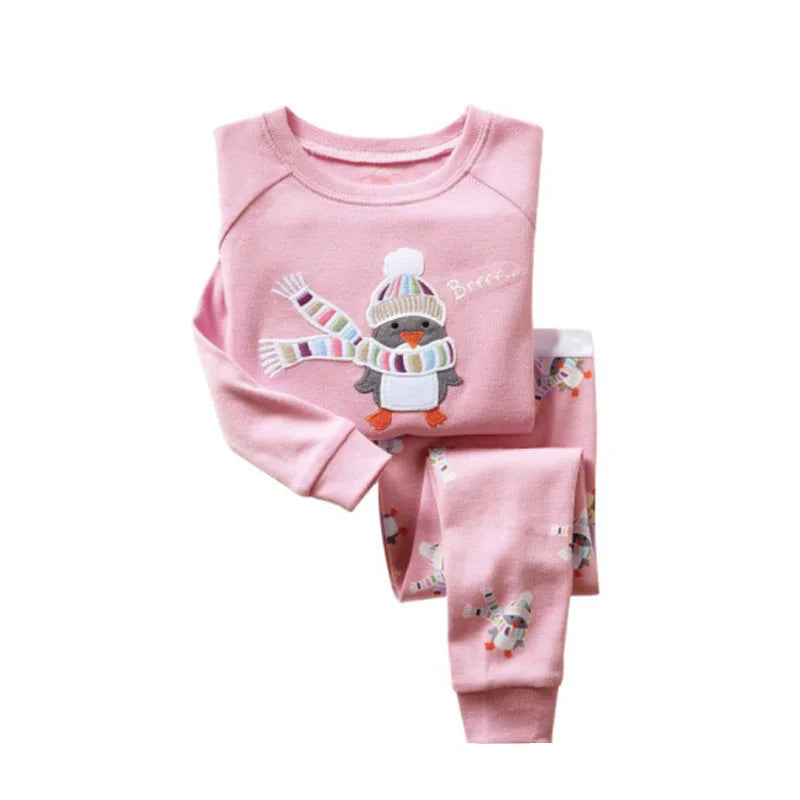 Kids Animal Pajama Set in soft pink knitted cotton, featuring a long-sleeve top and pants with a scarf-wearing penguin print.