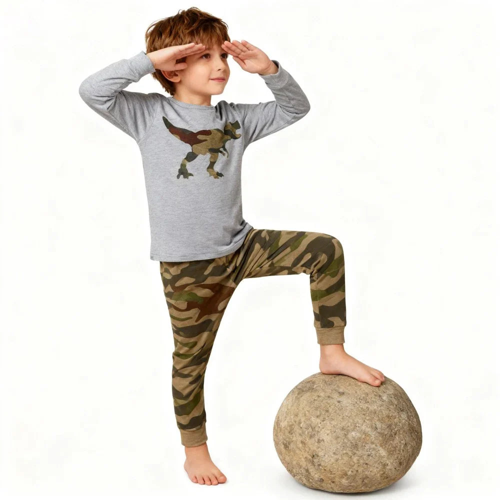Kids Animal Pajama Set in soft gray knit cotton, with a dinosaur graphic top and green-brown camouflage pants.