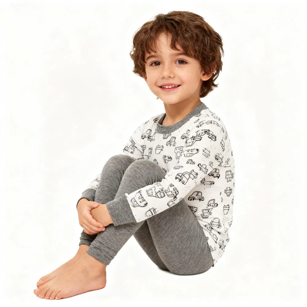 Kids Animal Pajama Set in soft knit cotton, with a white top printed with black vehicles and solid gray pants.