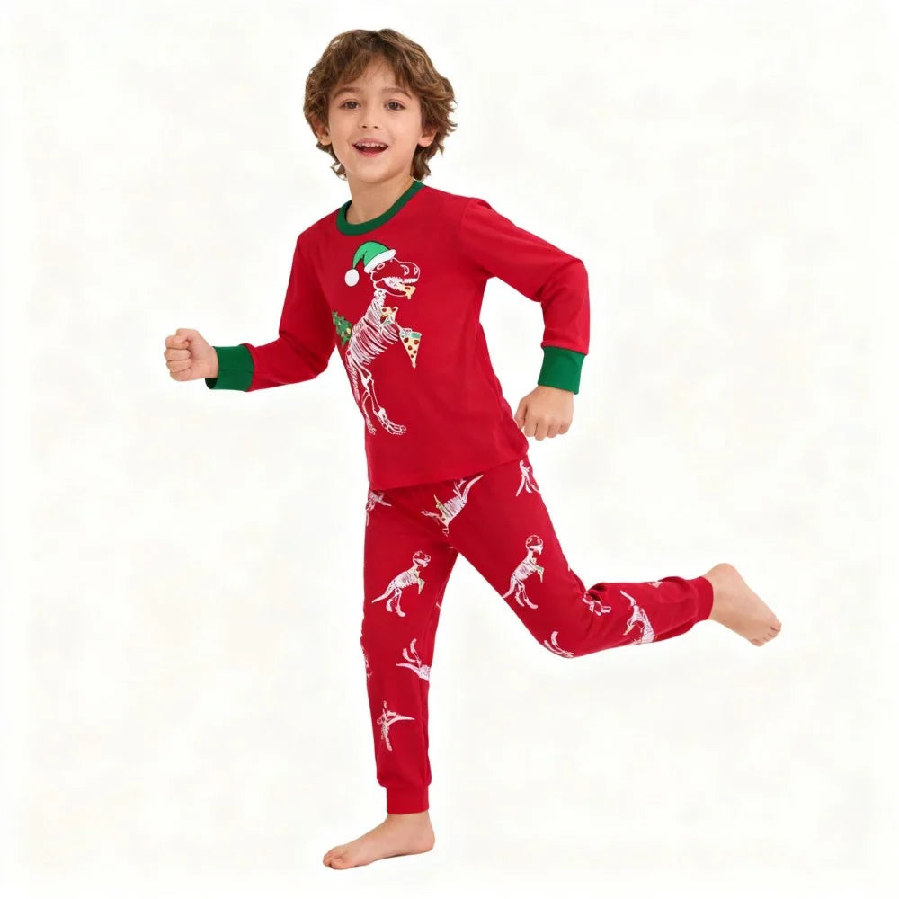 Kids Animal Pajama Set in red cotton knit, with green trim and playful white dinosaur prints on the top and pants.